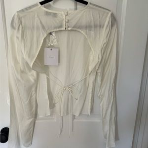 SOLD.  NWT L’academie the Anya Top in Ivory size S